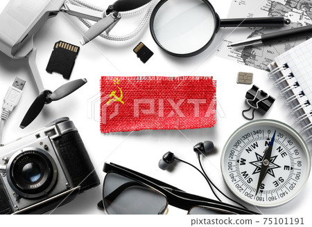 Flag of USSR and travel accessories on a white background. Flag of USSR and travel accessories on a white background. 75101191