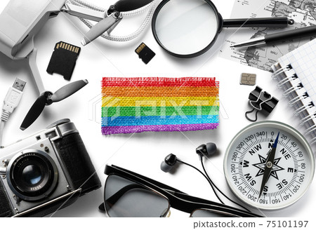 Flag of lgbt and travel accessories on a white background. Flag of lgbt and travel accessories on a white background. 75101197