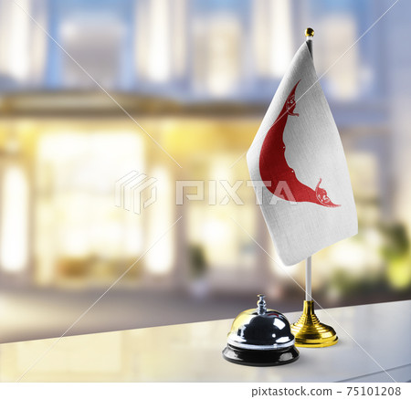 Easter Island flag on the reception desk in the lobby of the hotel Easter Island flag on the reception desk in the lobby of the hotel 75101208