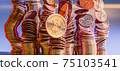 Cryptocurrency Bitcoin golden coins spilling on the table. 75103541