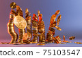 Cryptocurrency Bitcoin golden coins spilling on the table. 75103547