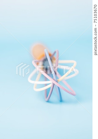Colored plastic whisk for whipping on a blue background, copy space Colored plastic whisk for whipping on a blue background, copy space 75103670