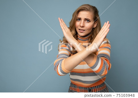 Portrait of young pretty beautiful sad angry dissatisfied blonde woman with sincere emotions wearing Portrait of young pretty beautiful sad angry dissatisfied blonde woman with sincere emotions wearing 75103948