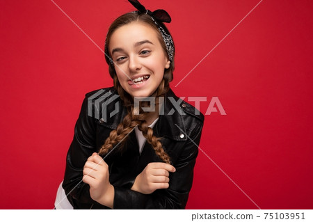 Photo shot of pretty positive smiling brunette little female teenager with pigtails wearing stylish 75103951