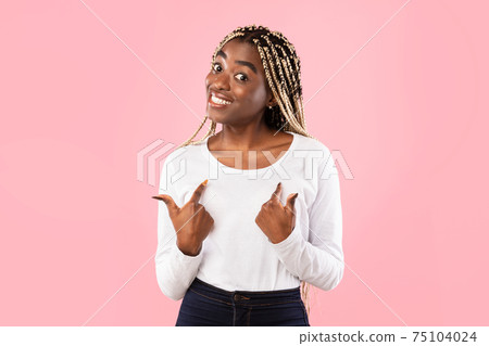 Happy black lady pointing fingers at herself Happy black lady pointing fingers at herself 75104024
