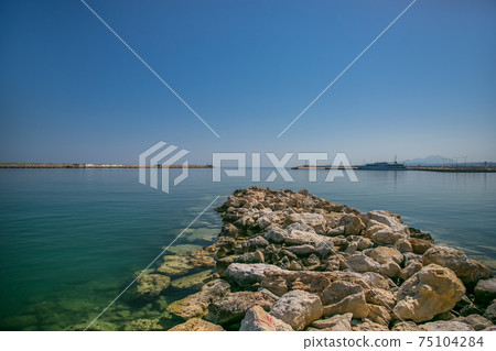harbor and lighthouse of the city of rethymno in in crete greece harbor and lighthouse of the city of rethymno in in crete greece 75104284