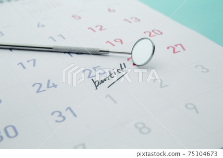 Dental health and teethcare concept. Dentist appointment in calendar and professional dental tools. Dental health and teethcare concept. Dentist appointment in calendar and professional dental tools. 75104673