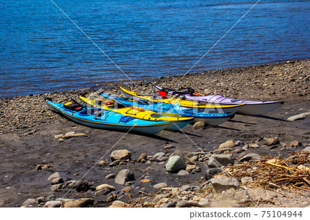 Multiple sea kayaks detained on the beach Marine sports Multiple sea kayaks detained on the beach Marine sports 75104944