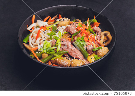 Udon noodles with chicken and peppers - Japanese cuisine. 75105973