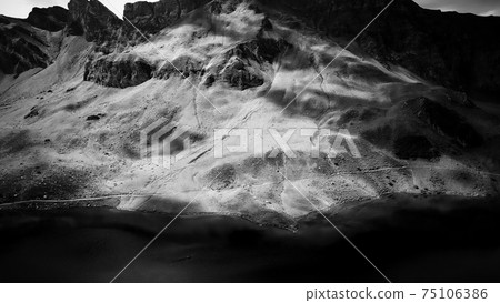 The Swiss Alps at Melchsee Frutt in black and white 75106386