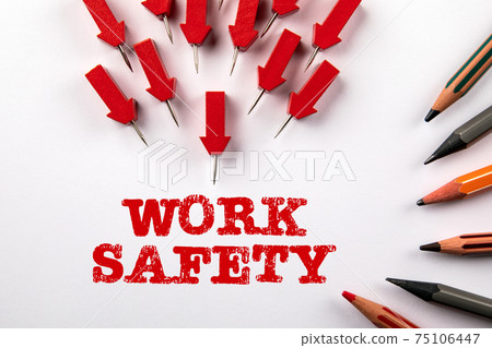 Work Safety concept. Red arrows and colored pencils on a white background Work Safety concept. Red arrows and colored pencils on a white background 75106447