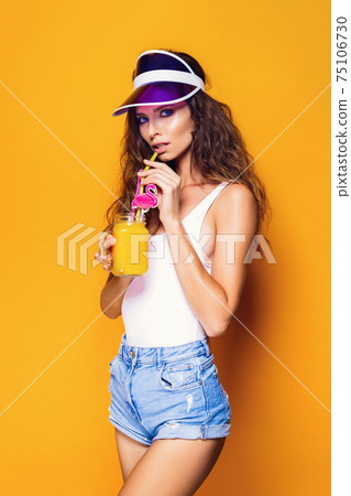 Sexy Woman in white swimsuit and blue jeans shorts, trendy visor Sexy Woman in white swimsuit and blue jeans shorts, trendy visor 75106730