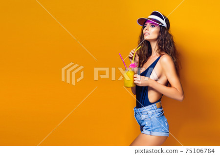 Sexy Woman in white swimsuit and blue jeans shorts, trendy visor Sexy Woman in white swimsuit and blue jeans shorts, trendy visor 75106784