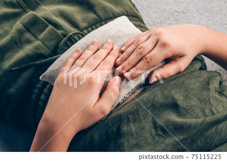 Autistic boy using cherry stone thermal pillows, cherry pit filled pillow - natural heat or cool pack. Alternative medicine and therapy, pit sack for spa massage, chiropractic care and home health 75115225