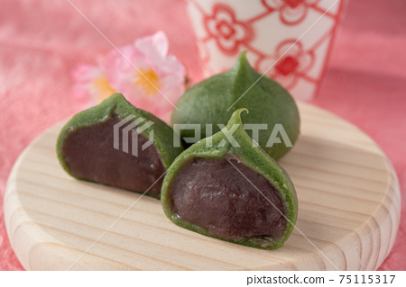 Two Kusa Mochi On A Round Wooden Plate Cross Stock Photo