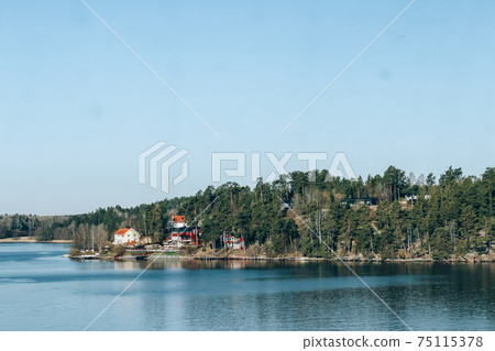 Spring Baltic Sea landscape near Stockholm seacost. Local tourism concept, spring nature, selective focus. Sweden nature, authentic archipelago Spring Baltic Sea landscape near Stockholm seacost. Local tourism concept, spring nature, selective focus. Sweden nature, authentic archipelago 75115378