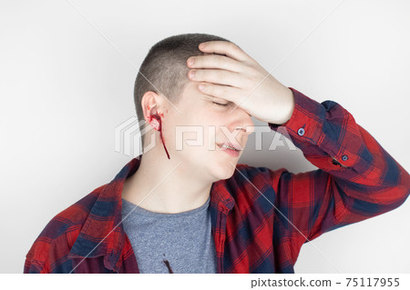 A man whose ear is bleeding. Vascular rupture, damage to the tympanic membrane, ear diseases, oncology, otitis media, myringitis A man whose ear is bleeding. Vascular rupture, damage to the tympanic membrane, ear diseases, oncology, otitis media, myringitis 75117955