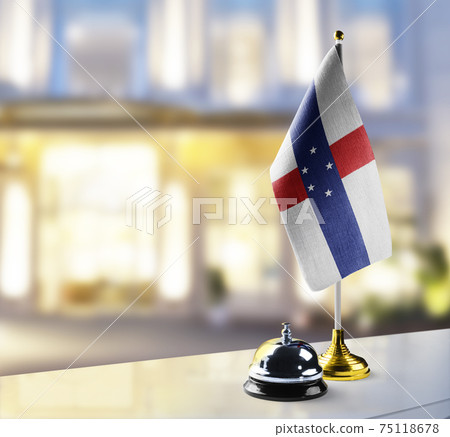 Netherlands Antilles flag on the reception desk in the lobby of the hotel Netherlands Antilles flag on the reception desk in the lobby of the hotel 75118678
