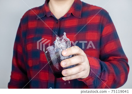 A patient with Parkinson's disease has trembling hands. Tremor of the extremities in various diseases. Close-up of a shivering man. Various objects tremble in hands. Neurological diseases 75119041