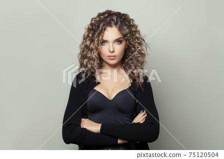 Healthy young woman with curly hairstyle on white background 75120504