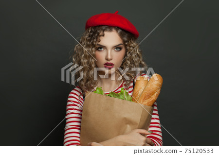 Portrait of a cheery woman dressed in striped t-shirt 75120533