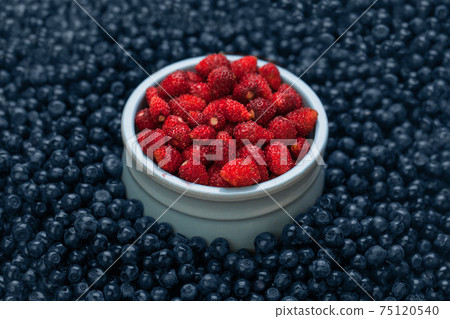 strawberry and bilberry, organic berries food background 75120540