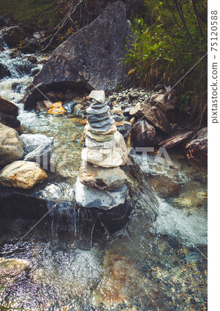 Cairn on a river in Vanoise national Park valley, French alps Cairn on a river in Vanoise national Park valley, French alps 75120588