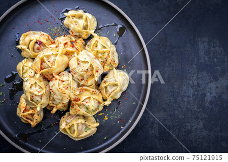 Traditional Kazakh manti steamed with mincemeat Traditional Kazakh manti steamed with mincemeat 75121915