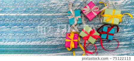 Five gifts. Gift boxes with origami ribbons. Blue turquoise background. Five gifts. Gift boxes with origami ribbons. Blue turquoise background. 75122113