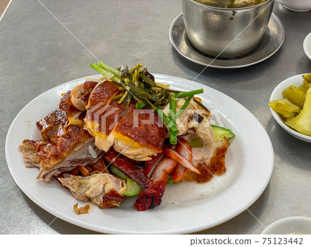 Plate of delicious Chinese Hainan roasted chicken and pork 75123442