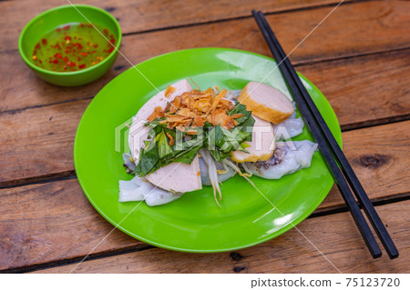Traditional Vietnamese rice noodle rolls topped with fried shallot Traditional Vietnamese rice noodle rolls topped with fried shallot 75123720
