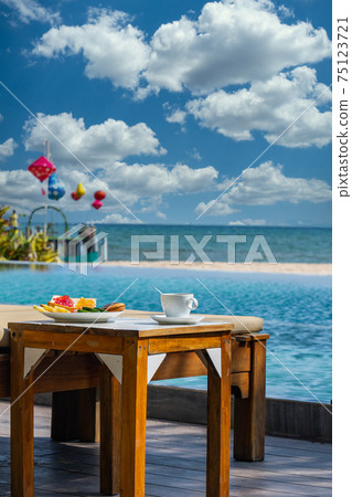 Vertical photo of amazing view in the pool in cloudy day Vertical photo of amazing view in the pool in cloudy day 75123721