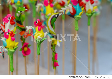 Close up photo of tiny Chinese dough sculpture figures Close up photo of tiny Chinese dough sculpture figures 75123782