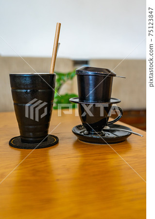 Vietnamese style dripping coffee brewed with metallic filter Vietnamese style dripping coffee brewed with metallic filter 75123847
