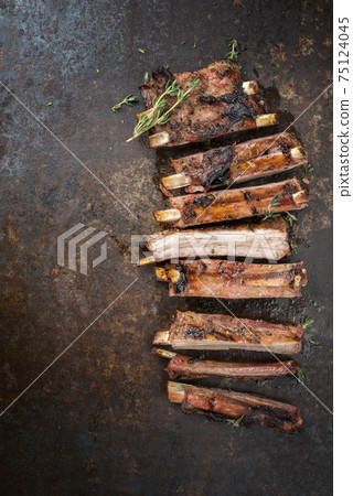 Barbecue spare ribs St Louis style with hot honey chili marinade sliced  75124045