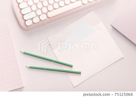 flat lay pink color envelope and stationery 75125068