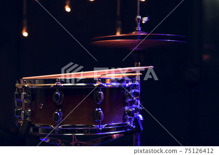 Snare drum and hi-hat in the dark close up. Snare drum and hi-hat in the dark close up. 75126412