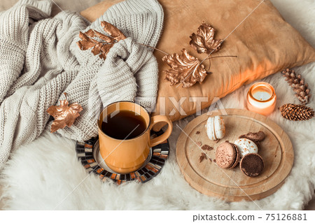 Still life Cup of tea with autumn leaves and sweater. Still life Cup of tea with autumn leaves and sweater. 75126881