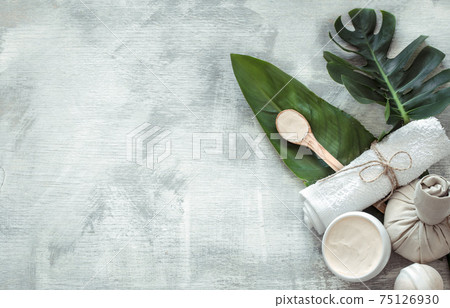 Spa composition with body care items on a light background. 75126930