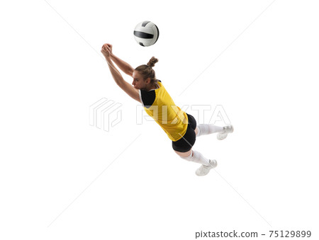 Young female volleyball player isolated on white studio background. Woman in sport's equipment training and practicing. 75129899