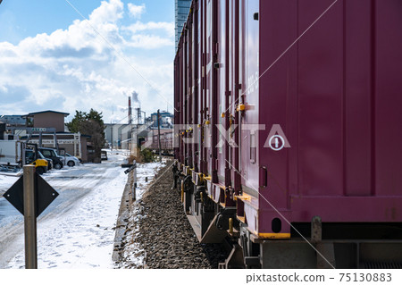Photographing a freight train from behind Photographing a freight train from behind 75130883