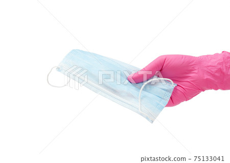 Female doctor in a glove holding a medical mask in his hand. Female doctor in a glove holding a medical mask in his hand. 75133041