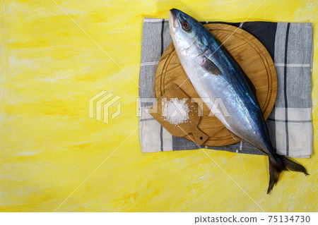 large seriola amberjack is a dumerili on a yellow background. top view 75134730