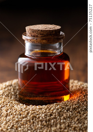 Sesame oil in a bottle Sesame oil in a bottle 75135227