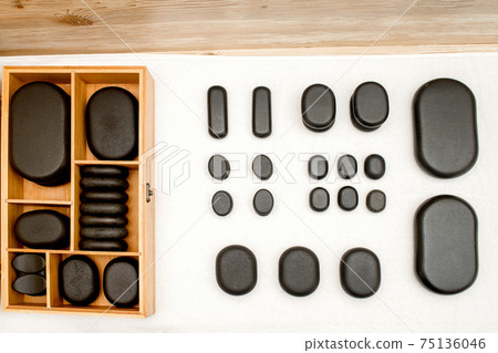 Wooden case with spa stones 75136046