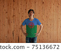 Man wearing Romani people flag color shirt and standing with akimbo 75136672
