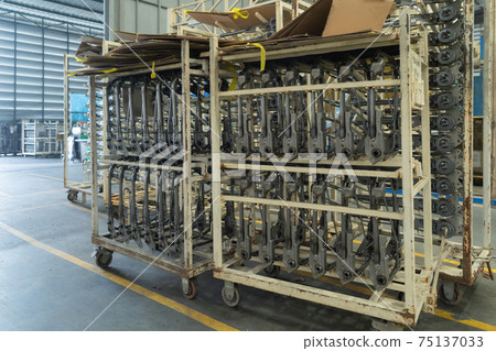 Car seat metal steel structure manufacturing factory with equipment machine engine industrial production system work, technology in operation process in industry plant. Product equipment in warehouse. Car seat metal steel structure manufacturing factory with equipment machine engine industrial production system work, technology in operation process in industry plant. Product equipment in warehouse. 75137033