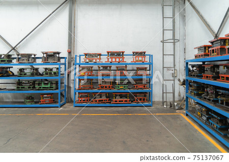 Car seat metal steel structure manufacturing factory with equipment machine engine industrial production system work, technology in operation process in industry plant. Product equipment in warehouse. 75137067