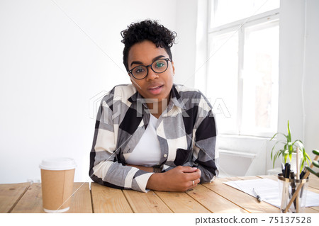 Confident African American applicant answering questions at job interview Confident African American applicant answering questions at job interview 75137528