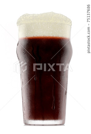 Frosty glass of fresh stout beer with bubble froth isolated on white background. Frosty glass of fresh stout beer with bubble froth isolated on white background. 75137686